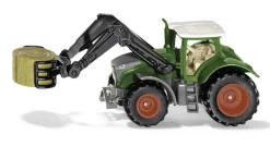 Tracteur avec chargeur et pince à balles