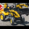 Tractopelle Komatsu avec excavatrice arrière et remorque